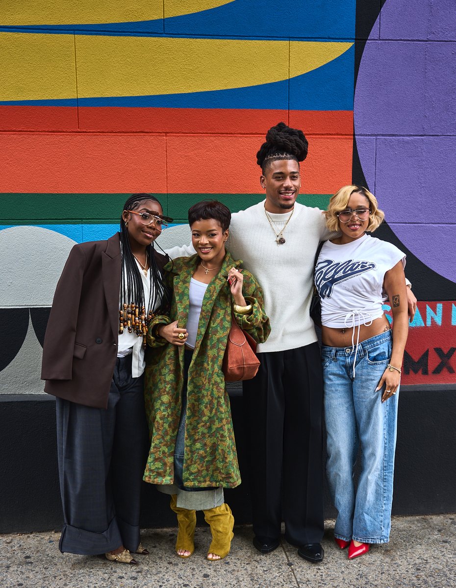 The cast of A Different World outside Unity Prep Charter School of Brooklyn